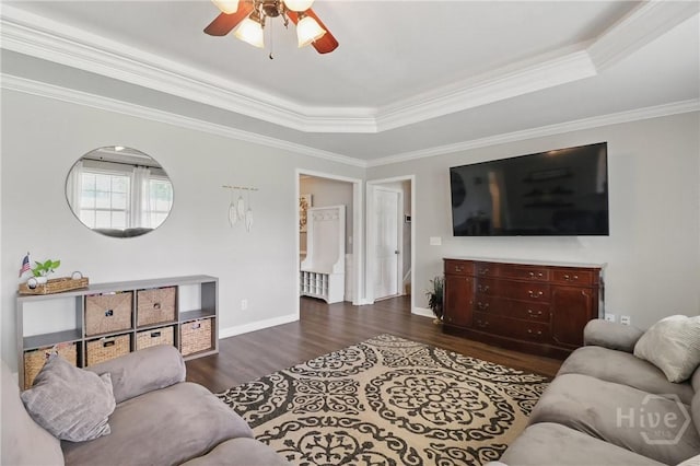 509 Braves Field Dr, Guyton, GA 31312 - living room with wood finished floors, ceiling fan, a raised ceiling, baseboards, and ornamental molding