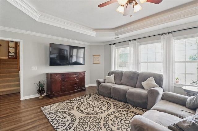 509 Braves Field Dr, Guyton, GA 31312 - living area with a raised ceiling, ceiling fan, baseboards, dark wood-type flooring, and stairway