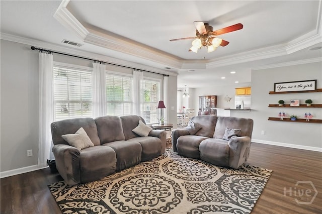 509 Braves Field Dr, Guyton, GA 31312 - living area with a tray ceiling, crown molding, a ceiling fan, dark wood-style flooring, and baseboards
