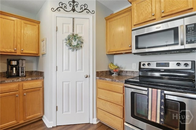 509 Braves Field Dr, Guyton, GA 31312 - kitchen with appliances with stainless steel finishes and dark wood-style floors