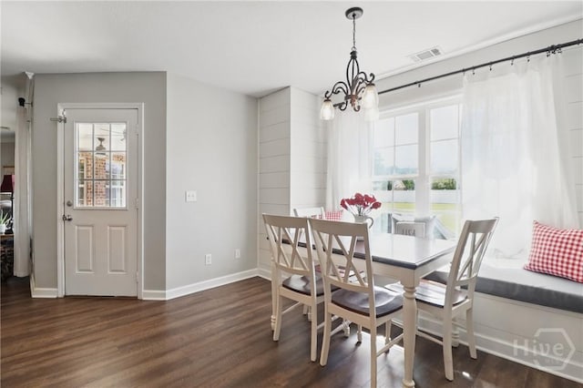 509 Braves Field Dr, Guyton, GA 31312 - dining area featuring a chandelier, plenty of natural light, dark wood-type flooring, and baseboards