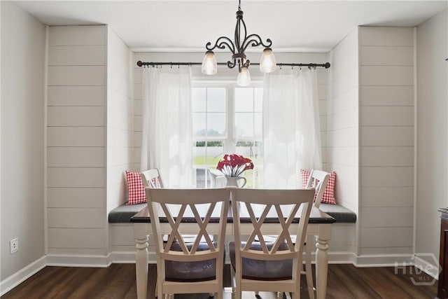 509 Braves Field Dr, Guyton, GA 31312 - dining area with a chandelier, dark wood finished floors, and baseboards