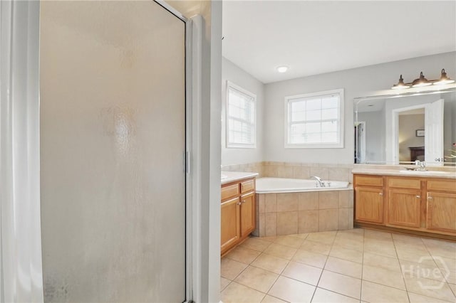 509 Braves Field Dr, Guyton, GA 31312 - full bath featuring a stall shower, tile patterned floors, a garden tub, and vanity