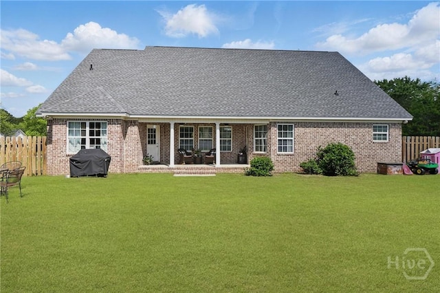 509 Braves Field Dr, Guyton, GA 31312 - back of property with brick siding, roof with shingles, and a patio