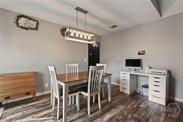 1405 Desert Storm Dr, Hinesville, GA 31313 - dining area featuring wood finished floors, baseboards, and a textured ceiling