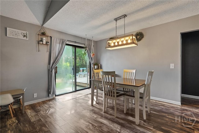 1405 Desert Storm Dr, Hinesville, GA 31313 - dining space with wood finished floors, a textured ceiling, and baseboards