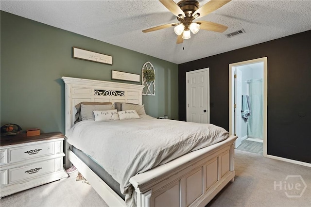 1405 Desert Storm Dr, Hinesville, GA 31313 - bedroom featuring light carpet, a textured ceiling, ensuite bath, a ceiling fan, and baseboards