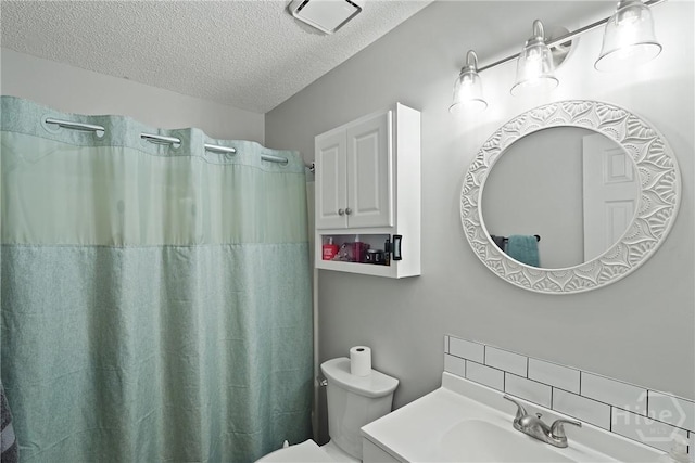 1405 Desert Storm Dr, Hinesville, GA 31313 - bathroom featuring a textured ceiling, decorative backsplash, toilet, curtained shower, and vanity