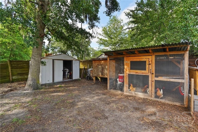 1405 Desert Storm Dr, Hinesville, GA 31313 - view of shed featuring exterior structure and fence