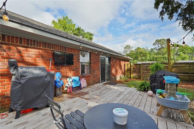 1405 Desert Storm Dr, Hinesville, GA 31313 - wooden terrace featuring fence and grilling area