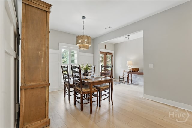 dining room with light wood-type flooring