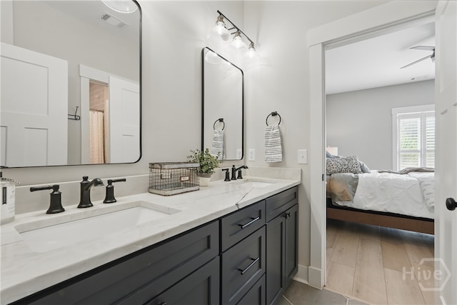 bathroom with ensuite bath and double vanity