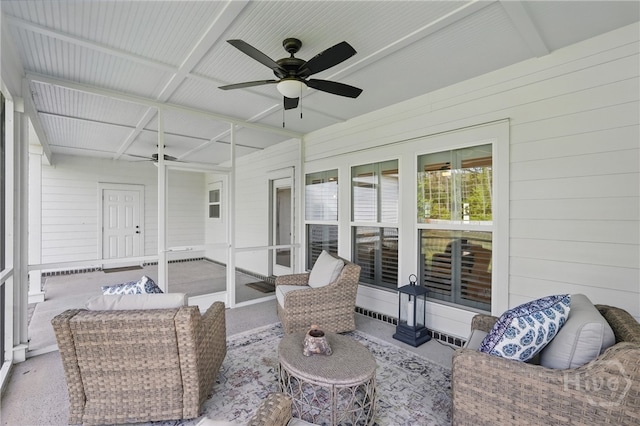 sunroom with ceiling fan and an outdoor hangout area