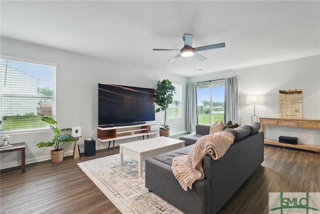 1546 Wilkins Rd, Midway, GA 31320 - living room with ceiling fan, baseboards, and dark wood-style floors