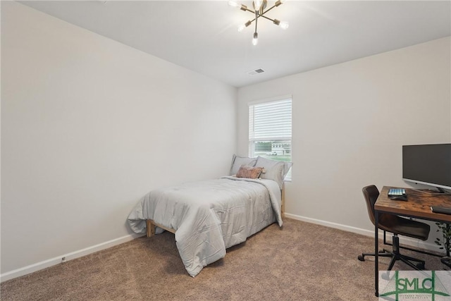 1546 Wilkins Rd, Midway, GA 31320 - bedroom with light colored carpet, baseboards, a chandelier, and an office area