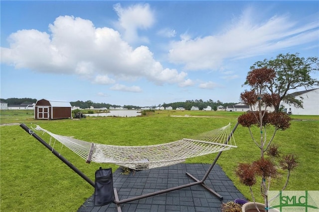 1546 Wilkins Rd, Midway, GA 31320 - view of property's community featuring a water view, a shed, a yard, and an outdoor structure