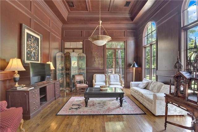3021 Whitemarsh Way, Savannah, GA 31410 - living room featuring a decorative wall, ornamental molding, and wood finished floors