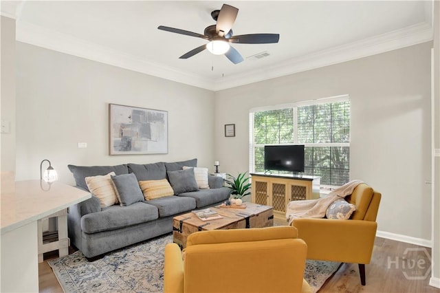 3021 Whitemarsh Way, Savannah, GA 31410 - living area with wood finished floors, a ceiling fan, crown molding, and baseboards