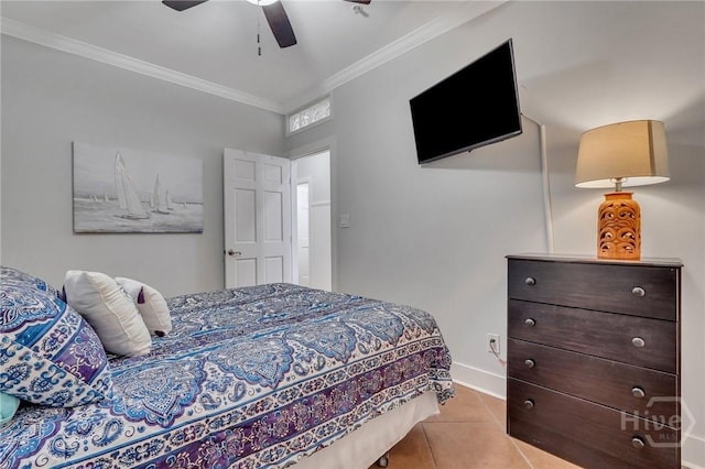5 17th St, Tybee Island, GA 31328 - tiled bedroom featuring ornamental molding, a ceiling fan, and baseboards