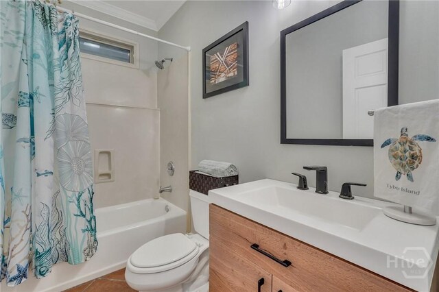 5 17th St, Tybee Island, GA 31328 - full bathroom featuring shower / bathtub combination with curtain, toilet, ornamental molding, vanity, and tile patterned flooring