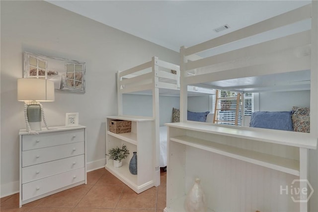 5 17th St, Tybee Island, GA 31328 - bedroom featuring tile patterned flooring and baseboards