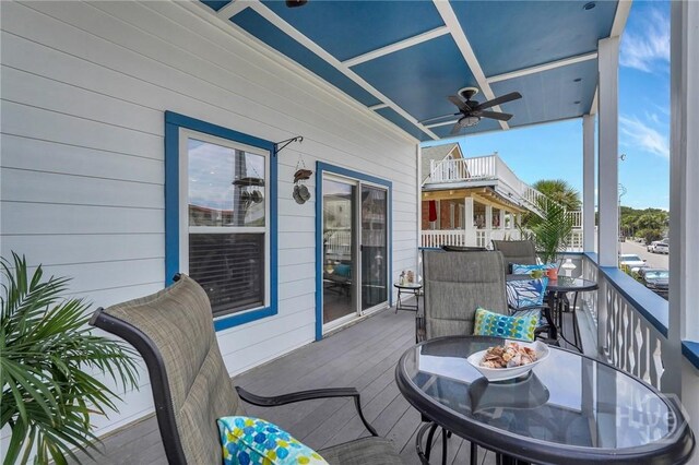 5 17th St, Tybee Island, GA 31328 - wooden deck with ceiling fan and outdoor dining area