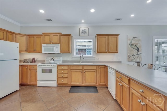 5 17th St, Tybee Island, GA 31328 - kitchen featuring white appliances, a sink, healthy amount of natural light, light countertops, and recessed lighting