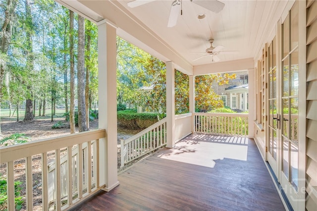 wooden deck featuring ceiling fan