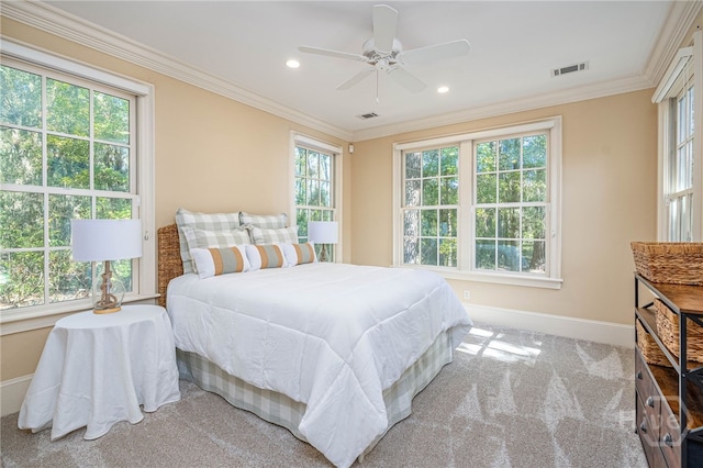 carpeted bedroom with multiple windows, baseboards, ornamental molding, recessed lighting, and ceiling fan