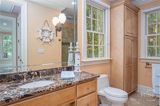 bathroom with vanity, crown molding, marble finish floors, and toilet