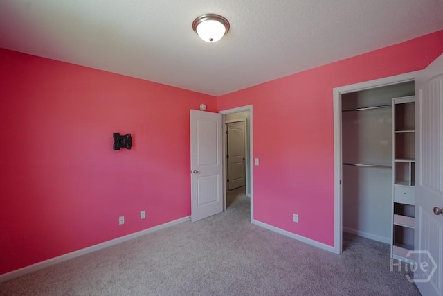 24 Daylily Ct, Hinesville, GA 31313 - unfurnished bedroom with carpet floors, a closet, and baseboards