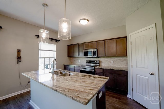 24 Daylily Ct, Hinesville, GA 31313 - kitchen with stainless steel appliances, a sink, tasteful backsplash, and dark wood-type flooring