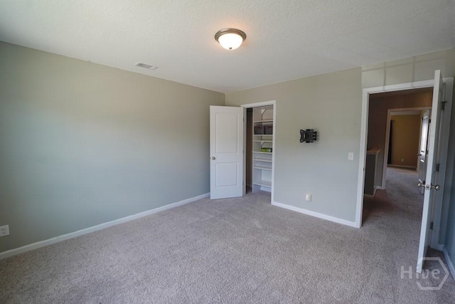 24 Daylily Ct, Hinesville, GA 31313 - unfurnished bedroom with carpet flooring, baseboards, and a closet