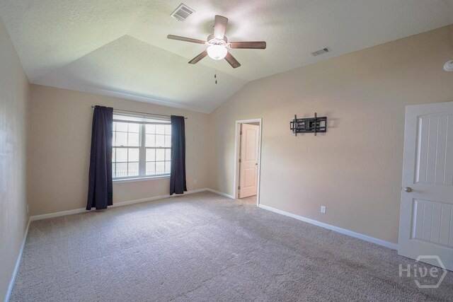 24 Daylily Ct, Hinesville, GA 31313 - unfurnished room featuring light carpet, lofted ceiling, ceiling fan, and baseboards