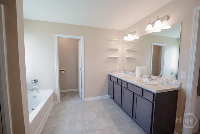 24 Daylily Ct, Hinesville, GA 31313 - bathroom with double vanity, a bath, tile patterned flooring, and baseboards