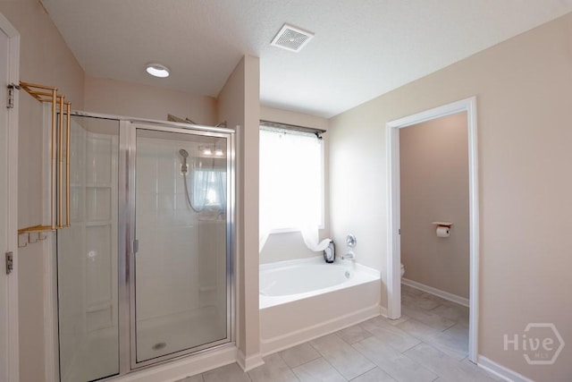 24 Daylily Ct, Hinesville, GA 31313 - full bath with a shower stall, toilet, a garden tub, and baseboards