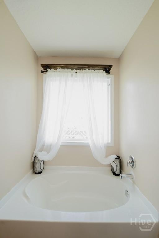 24 Daylily Ct, Hinesville, GA 31313 - full bathroom with a bath