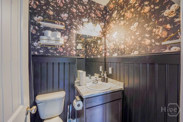 24 Daylily Ct, Hinesville, GA 31313 - half bathroom featuring wallpapered walls, wainscoting, toilet, and vanity