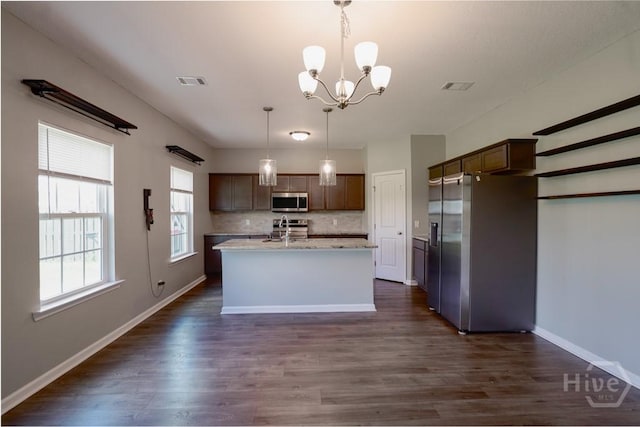 24 Daylily Ct, Hinesville, GA 31313 - kitchen featuring stainless steel appliances, dark wood-type flooring, a chandelier, and a kitchen island with sink