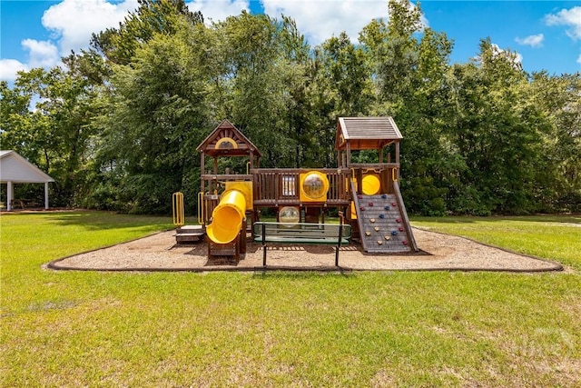 community jungle gym featuring a yard