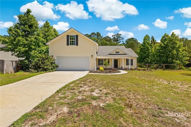 traditional-style home with a garage, driveway, and covered porch