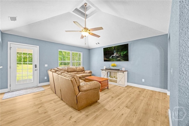 living room featuring wood finished floors, a ceiling fan, vaulted ceiling, and baseboards