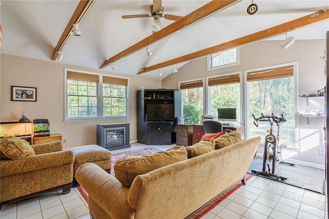 2 S Millward Rd, Savannah, GA 31410 - living room featuring track lighting, light tile patterned floors, healthy amount of natural light, and a ceiling fan