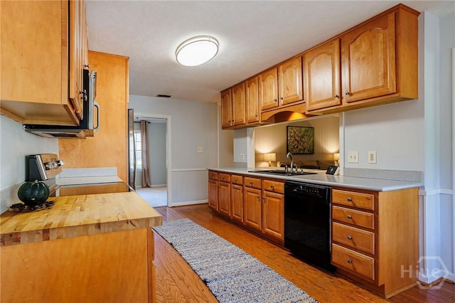 2 S Millward Rd, Savannah, GA 31410 - kitchen with stainless steel appliances, a sink, wood finished floors, brown cabinets, and butcher block countertops