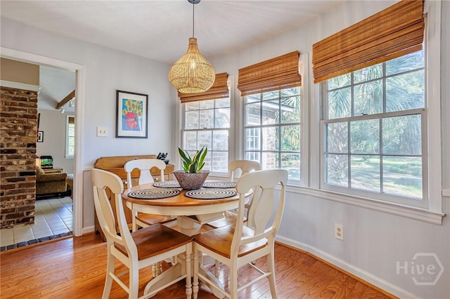 2 S Millward Rd, Savannah, GA 31410 - dining room with healthy amount of natural light, light wood-style flooring, and baseboards
