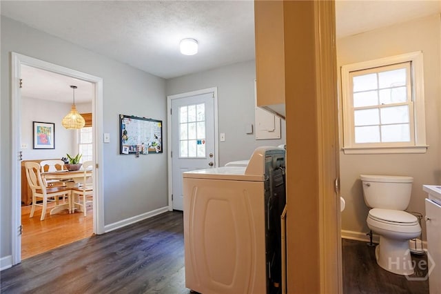 2 S Millward Rd, Savannah, GA 31410 - laundry room featuring washer / clothes dryer, dark wood finished floors, and baseboards