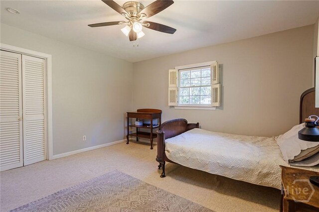 2 S Millward Rd, Savannah, GA 31410 - bedroom with light colored carpet, a closet, a ceiling fan, and baseboards