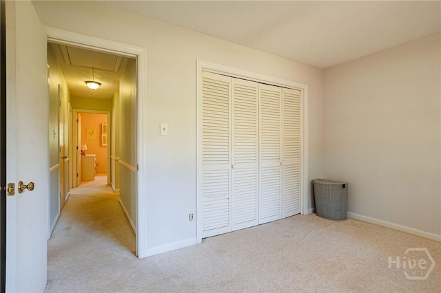 2 S Millward Rd, Savannah, GA 31410 - unfurnished bedroom with attic access, carpet floors, a closet, and baseboards