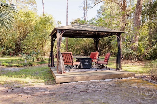 2 S Millward Rd, Savannah, GA 31410 - view of patio with a gazebo, a fire pit, and a wooden deck