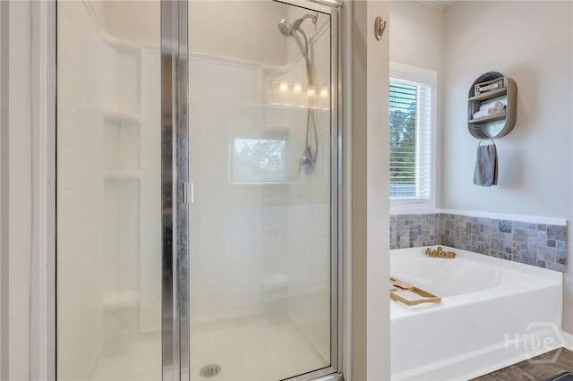 374 Bobwhite Trl NE, Ludowici, GA 31316 - bathroom featuring a shower stall and a garden tub